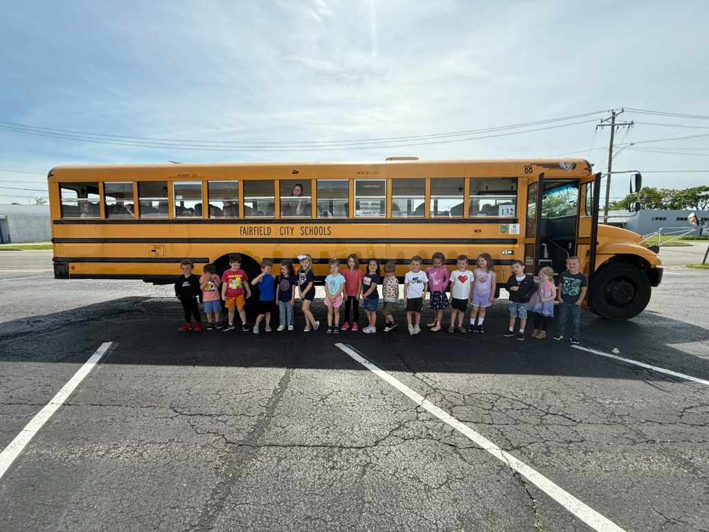 Children with school bus preparing for kindergarten